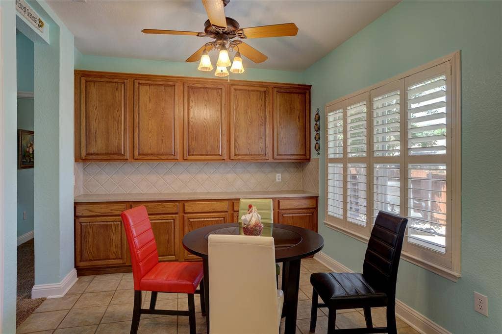 9909 Kaufman Place, Plano, TX 75025 Notice the wall of cabinets which only a few units in the subdivision upgraded