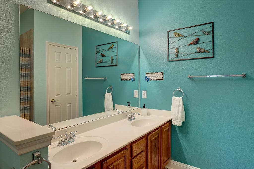 9909 Kaufman Place, Plano, TX 75025 Master bath with Handicap dual sinks which is rare in this subdivision