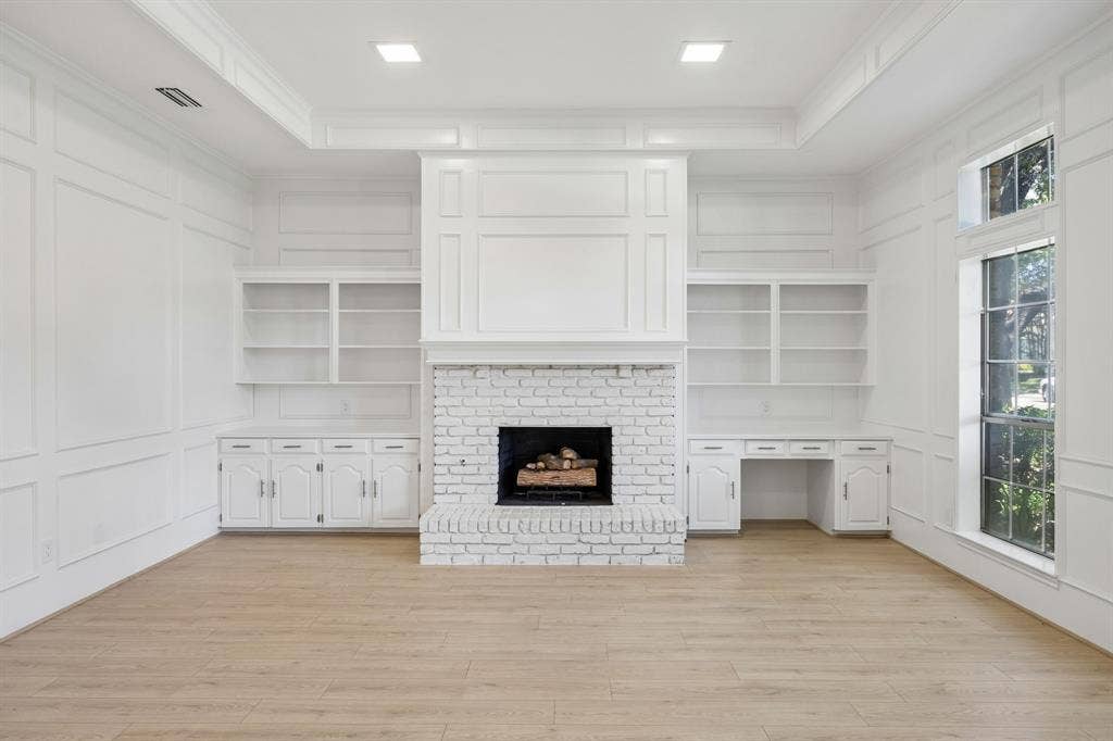 10014 Hickory Crossing, Dallas, TX 75243 Wood burning fireplace with built in book shelves and desk