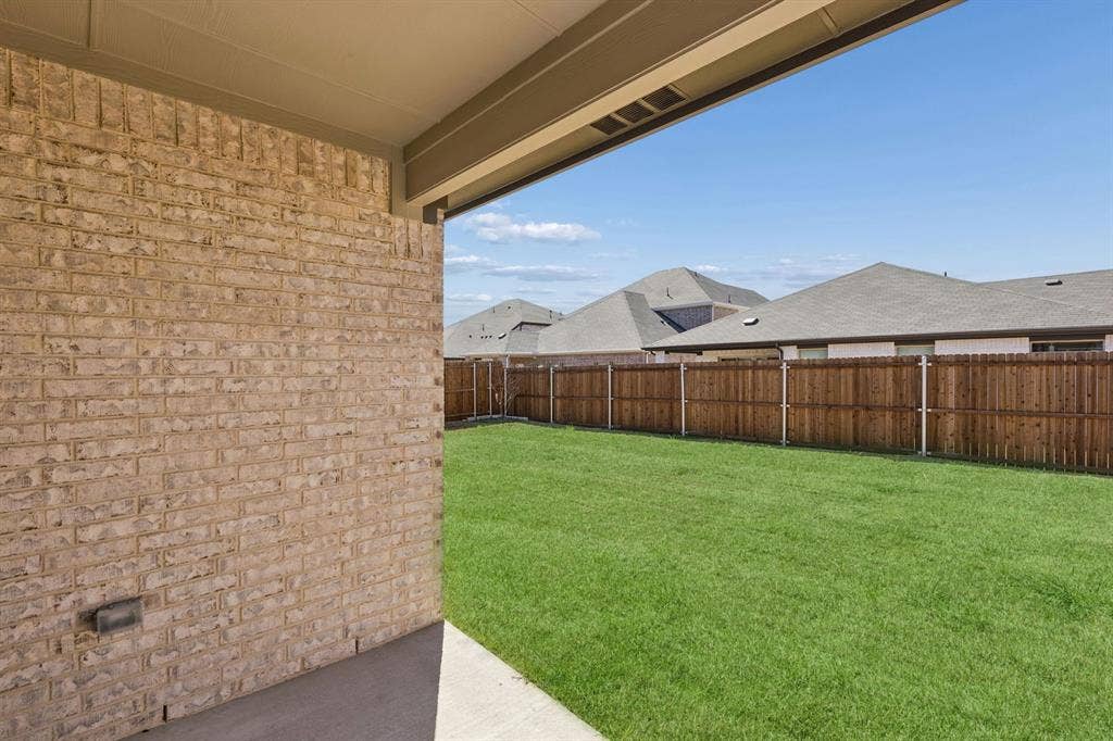 1117 Sundog Drive, Princeton, TX 75407 Covered Patio in the Harrison home plan by Trophy Signature Homes – REPRESENTATIVE PHOTO