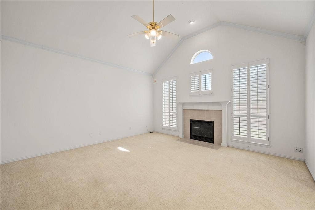 1013 Brook Arbor Drive, Mansfield, TX 76063 Living room opens to breakfast area and has fireplace and plantation shutters