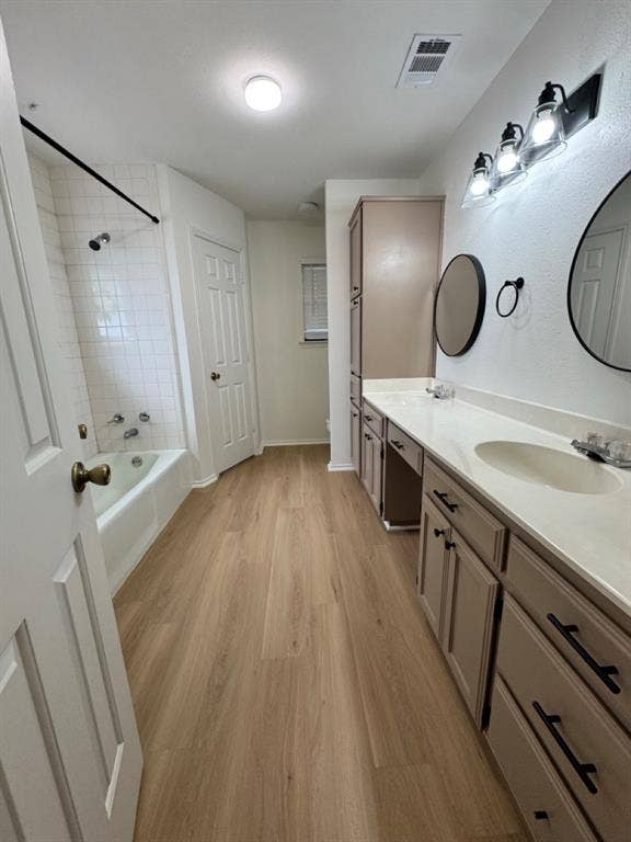 2812 Howard Court, Denton, TX 76209 Bathroom featuring a dual vanity with light-toned cabinetry and black hardware