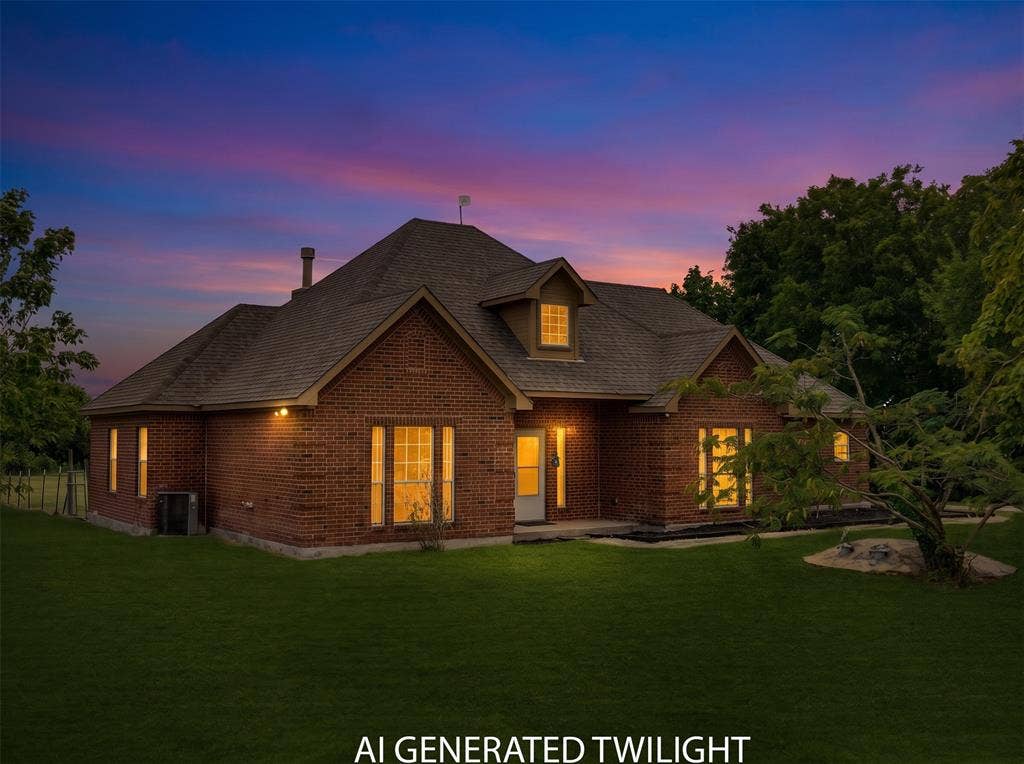 18723 Sims Lane, Nevada, TX 75173 Brick exterior residence featuring a gabled roofline, dormer window, and an expansive lawn