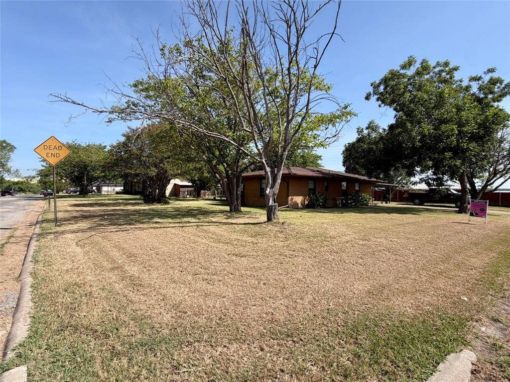 front corner view, large lot