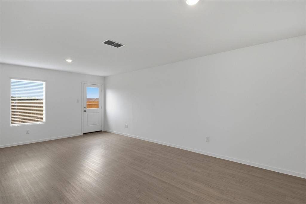 6307 Sandpiper Lane, Princeton, TX 75407 Spacious room with wood-finish flooring, white walls, and recessed lighting