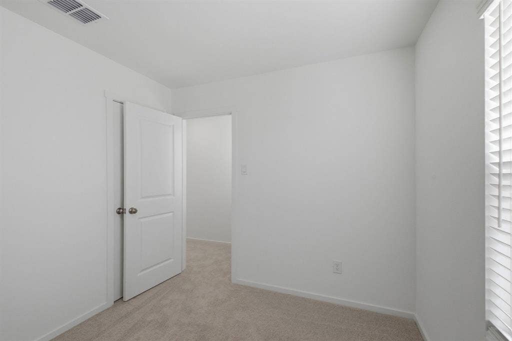 6307 Sandpiper Lane, Princeton, TX 75407 Neutral wall paint and plush carpeting create a versatile interior space