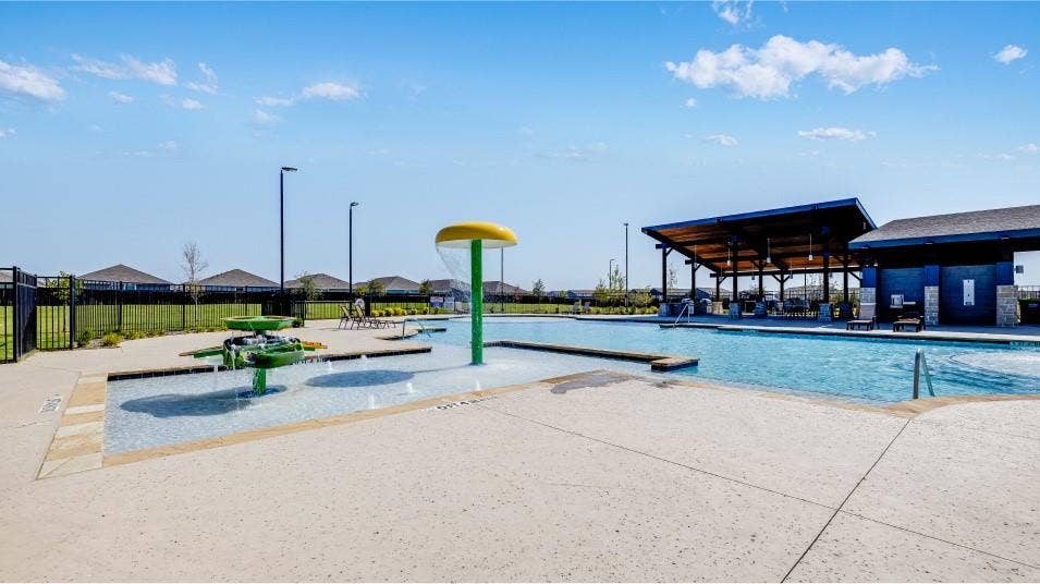 6307 Sandpiper Lane, Princeton, TX 75407 Resort-style aquatic amenity featuring a large swimming pool, splash pad with water features, expansive concrete decking, and an open-air pavilion