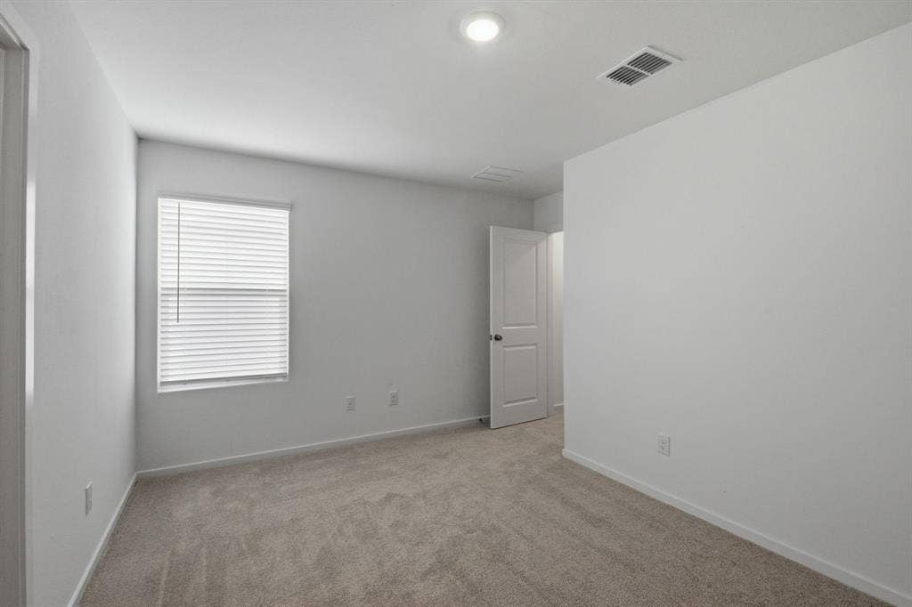 6307 Sandpiper Lane, Princeton, TX 75407 Carpeted room featuring a single window with blinds, white walls, and a recessed ceiling light