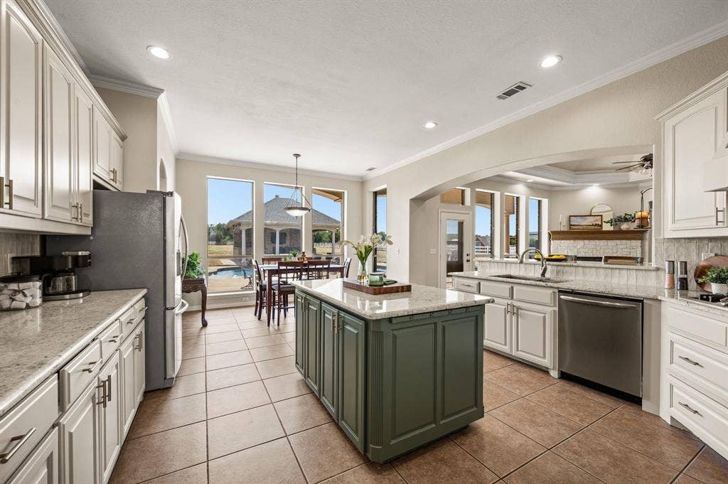 13425 Willow Creek Drive, Haslet, TX 76052 Tall windows ensure the backyard oasis is in clear view