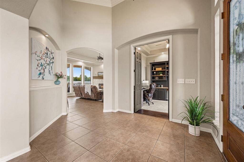 13425 Willow Creek Drive, Haslet, TX 76052 arches, substantial millwork, detailed ceilings, stone fireplace, built-ins and a fantastic wood-trimmed office.