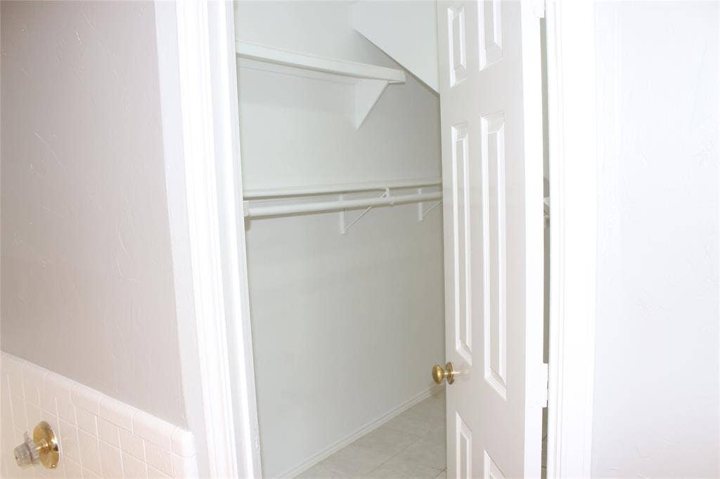 285 Alex Drive, Coppell, TX 75019 Walk-in closet with integrated shelving and hanging rods