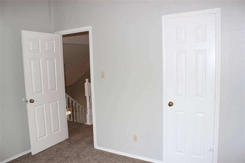 285 Alex Drive, Coppell, TX 75019 Interior space featuring light gray walls, textured carpeting, and white trim