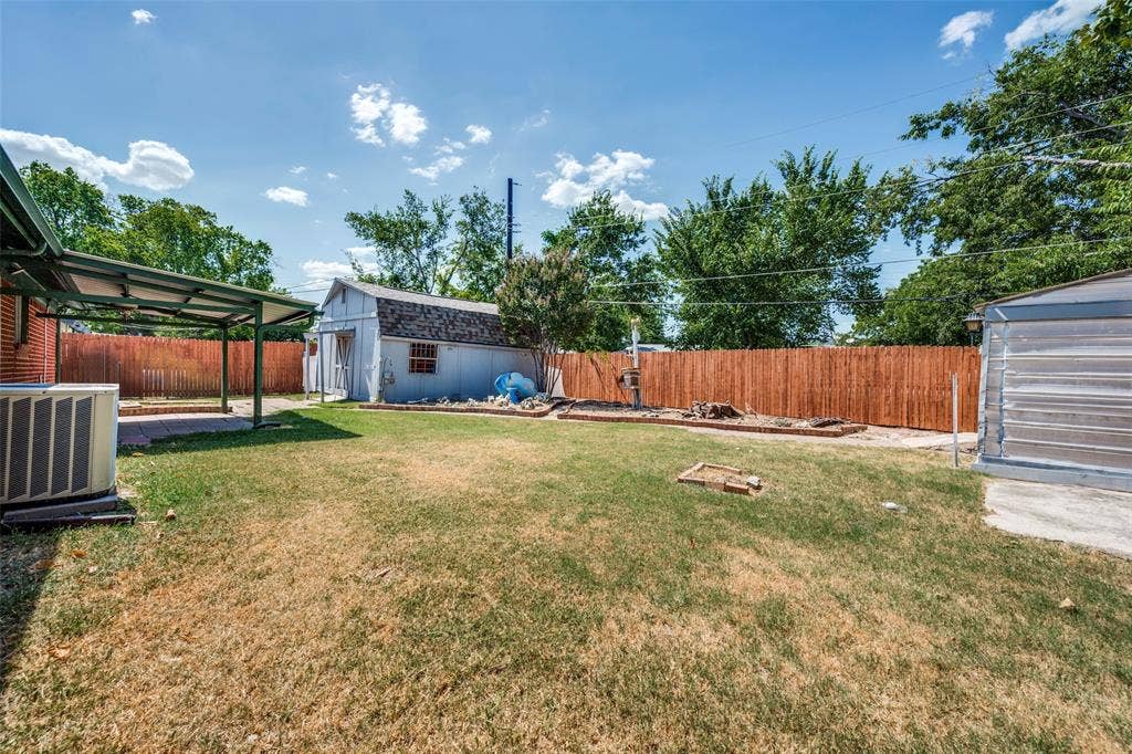 5213 Bonnie Wayne Street, Haltom City, TX 76117 Workshop and shed in back yard