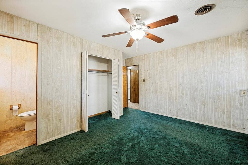 5213 Bonnie Wayne Street, Haltom City, TX 76117 Primary bedroom with attached half bath