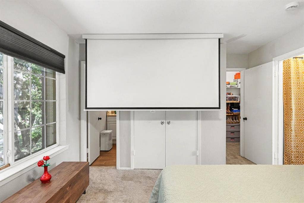 311 Towne House Lane, Richardson, TX 75081 Movie projector in Primary bedroom for cozy nights