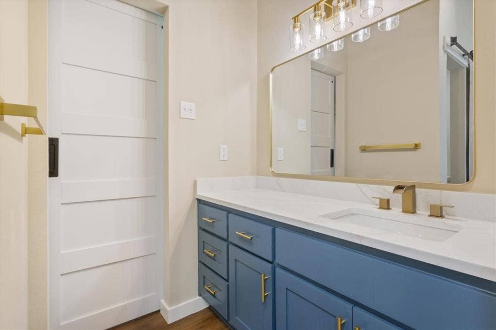116 Boleman Drive, Hewitt, TX 76643 Spacious vanity featuring a waterfall faucet, undermount sink, and quartz countertop