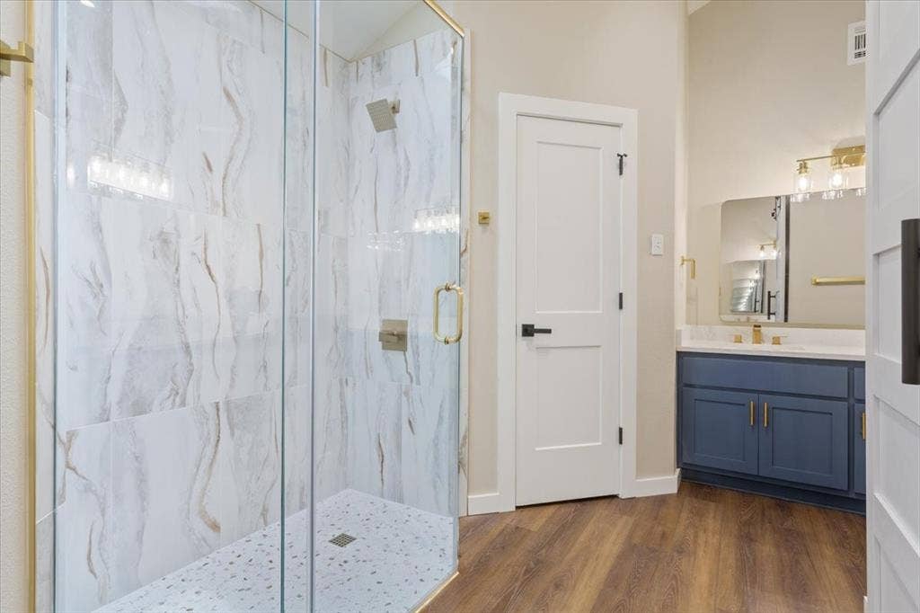 116 Boleman Drive, Hewitt, TX 76643 Primary ensuite bathroom custom glass-enclosed shower with large format marble-look tile walls and a mosaic tile floor