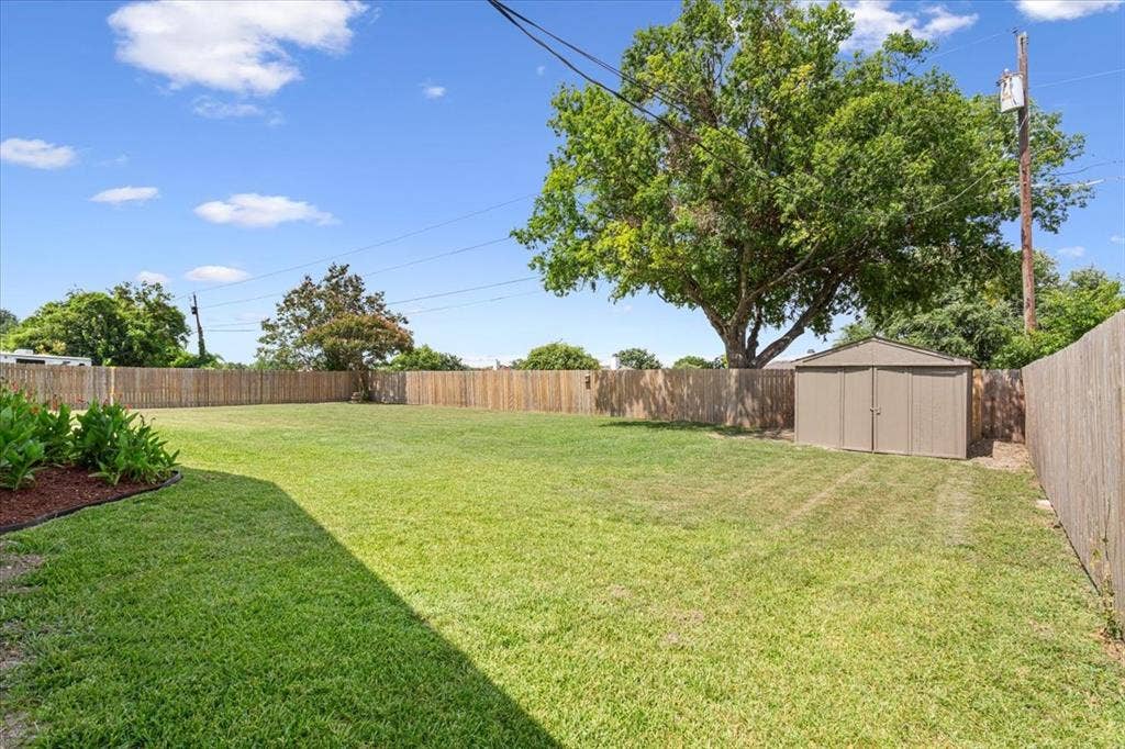 116 Boleman Drive, Hewitt, TX 76643 Expansive fenced backyard featuring a storage shed