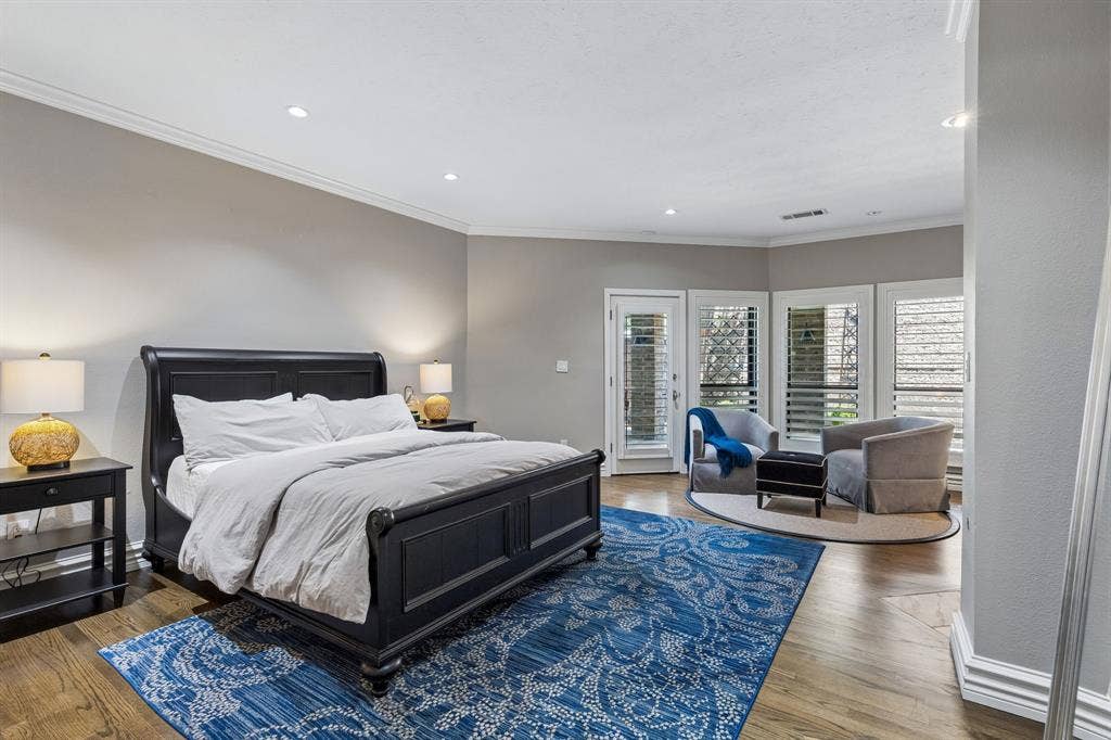 6015 Shetland Drive, Dallas, TX 75230 The primary retreat is calming and warm with sitting area and fireplace, and has access to the backyard.
