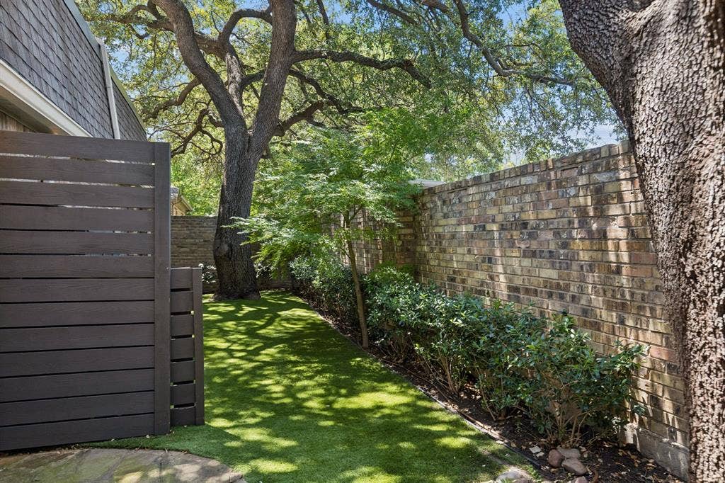 6015 Shetland Drive, Dallas, TX 75230 Sprawling oak trees, turfed yard, and lush landscape.