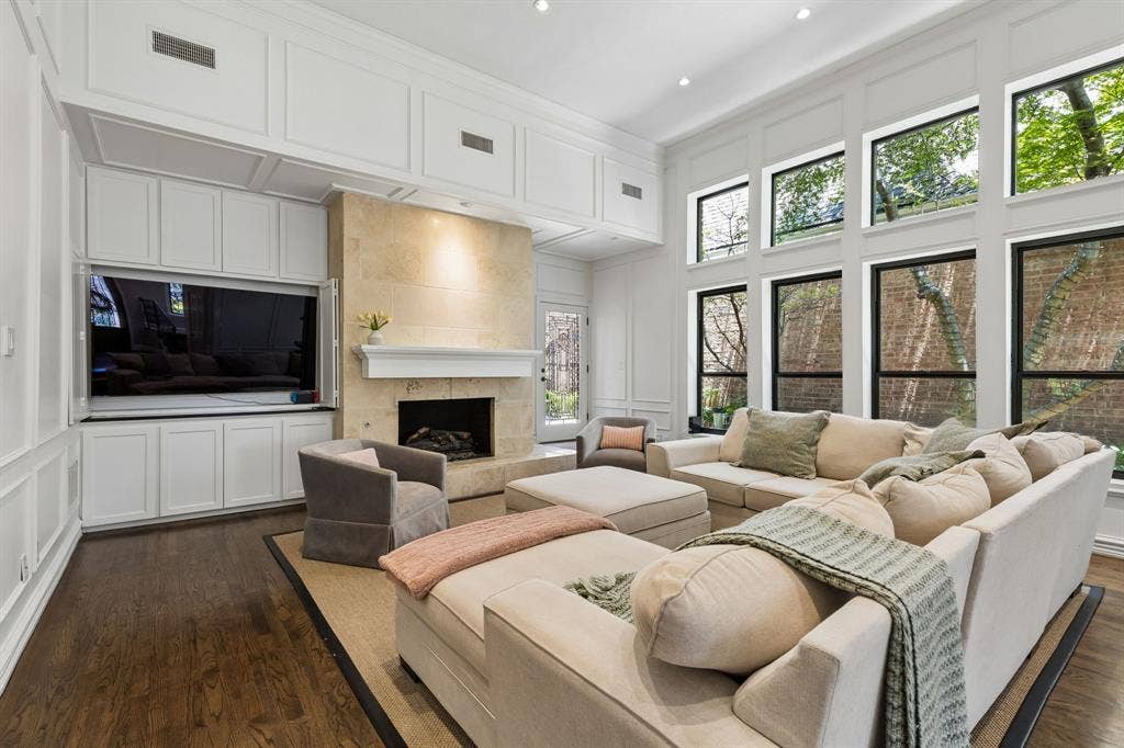 6015 Shetland Drive, Dallas, TX 75230 The travertine fireplace anchors the room beautifully.