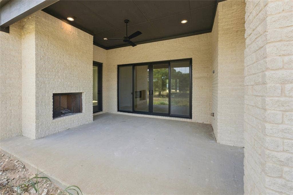 3820 Jacks Loop, Midlothian, TX 76065 Covered patio featuring an outdoor fireplace, recessed lighting, and a ceiling fan