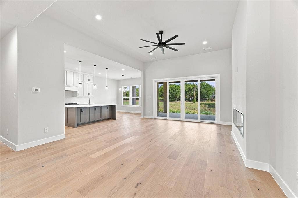 3820 Jacks Loop, Midlothian, TX 76065 Spacious interior featuring wood-finish flooring, a contemporary ceiling fan, and recessed lighting