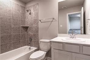 448 Ella Lane, Fate, TX 75087 Bathroom featuring a white bathtub, gray tiled shower surround with built-in shelf, white vanity with an integrated sink, and brushed nickel fixtures