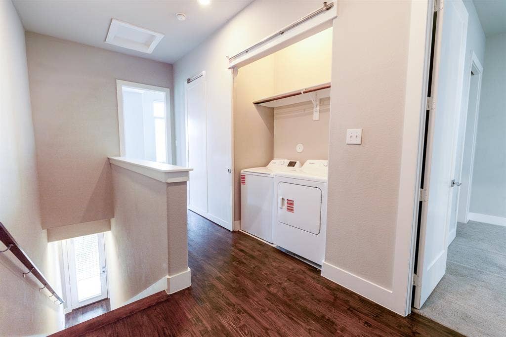 2514 Vintage Street, Farmers Branch, TX 75234 Hallway featuring wood-finish flooring, recessed lighting, and a built-in laundry area with shelving