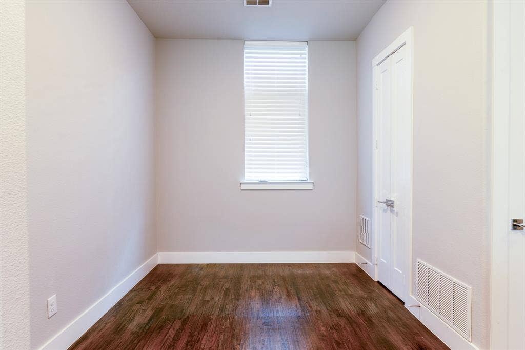 2514 Vintage Street, Farmers Branch, TX 75234 Dining area featuring wood-finish flooring, a single window with blinds, pantry and light neutral wall finishes
