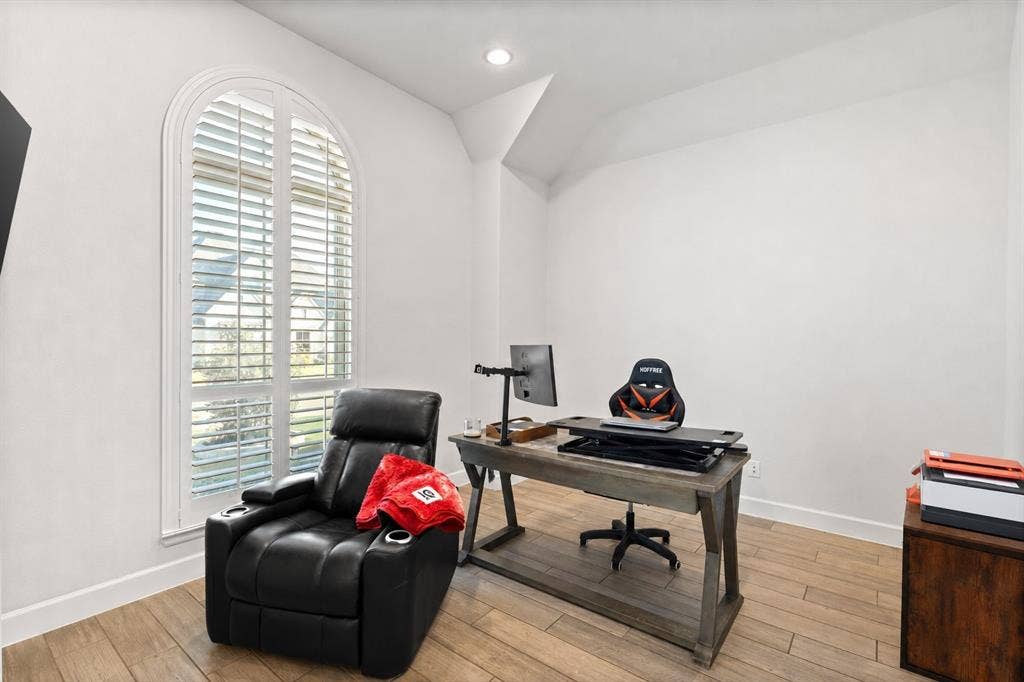 2837 Midlake Drive, Midlothian, TX 76065 Room featuring an arched window with plantation shutters, wood-finish flooring, recessed lighting, and white baseboards