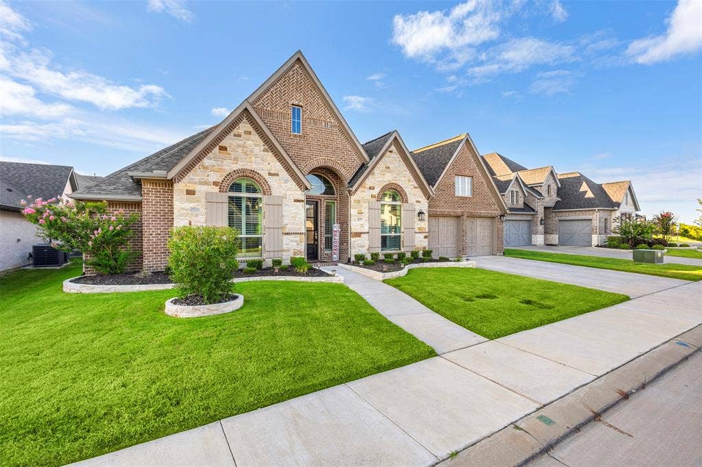 2837 Midlake Drive, Midlothian, TX 76065 Stone and brick exterior with arched window accents