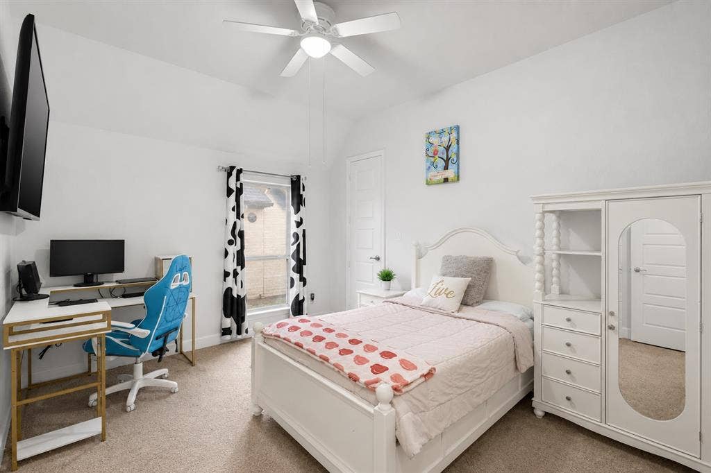 2837 Midlake Drive, Midlothian, TX 76065 Carpeted room featuring a ceiling fan with light fixture, a window with vertical blinds, and a built-in closet with a mirrored door