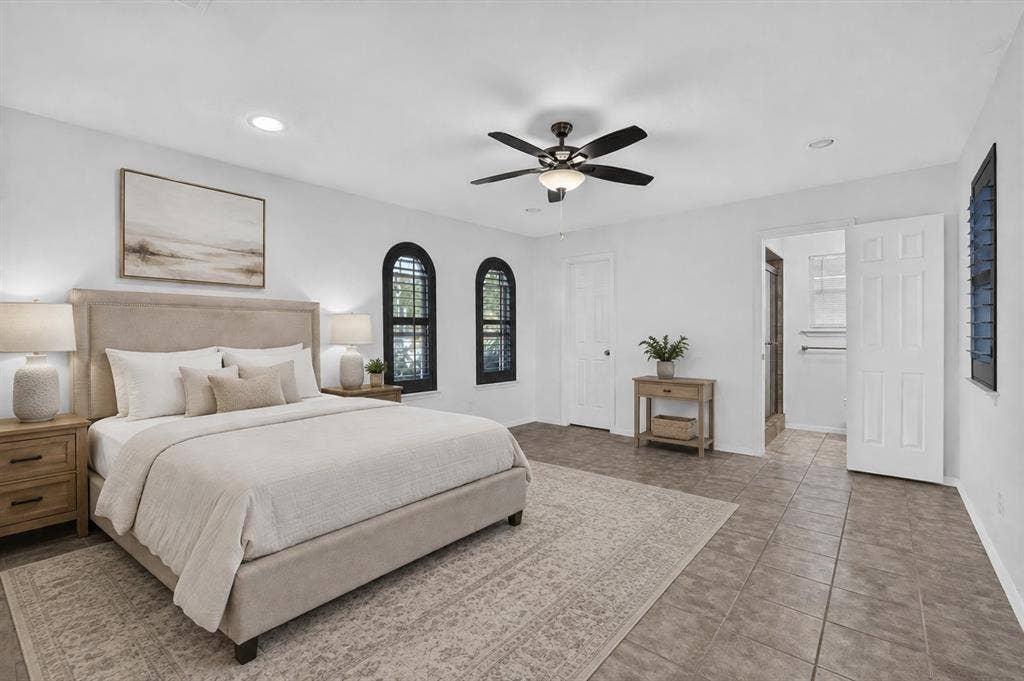 629 Newton Drive, Burleson, TX 76028 Virtually staged Spacious bedroom featuring light-toned walls and tile flooring
