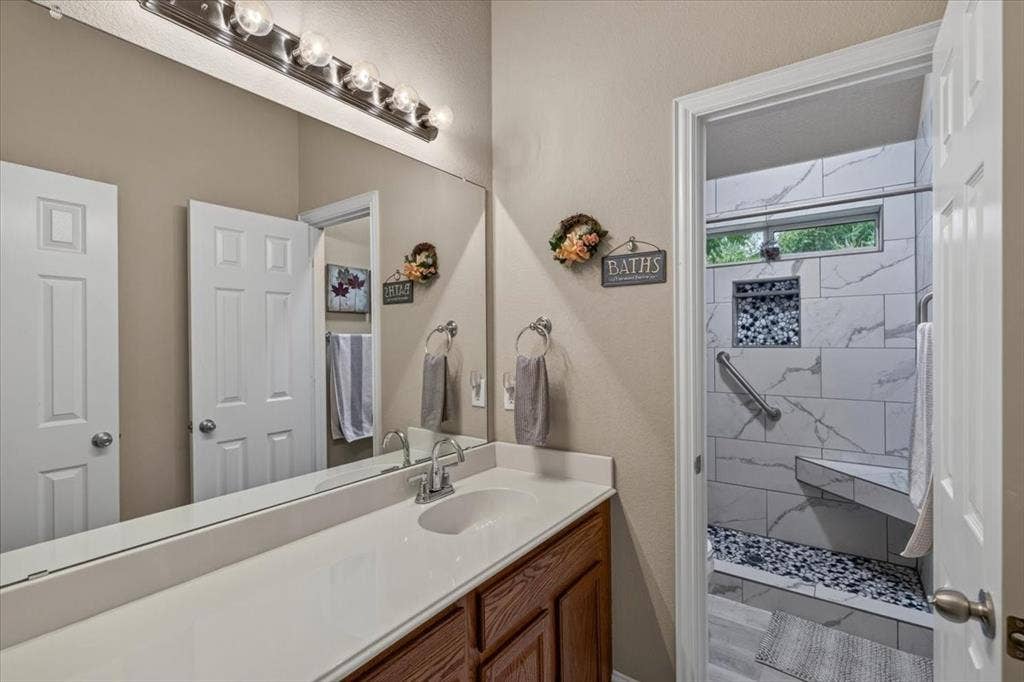10165 Bantry Lane, Forney, TX 75126 Hall bathroom with an updated shower