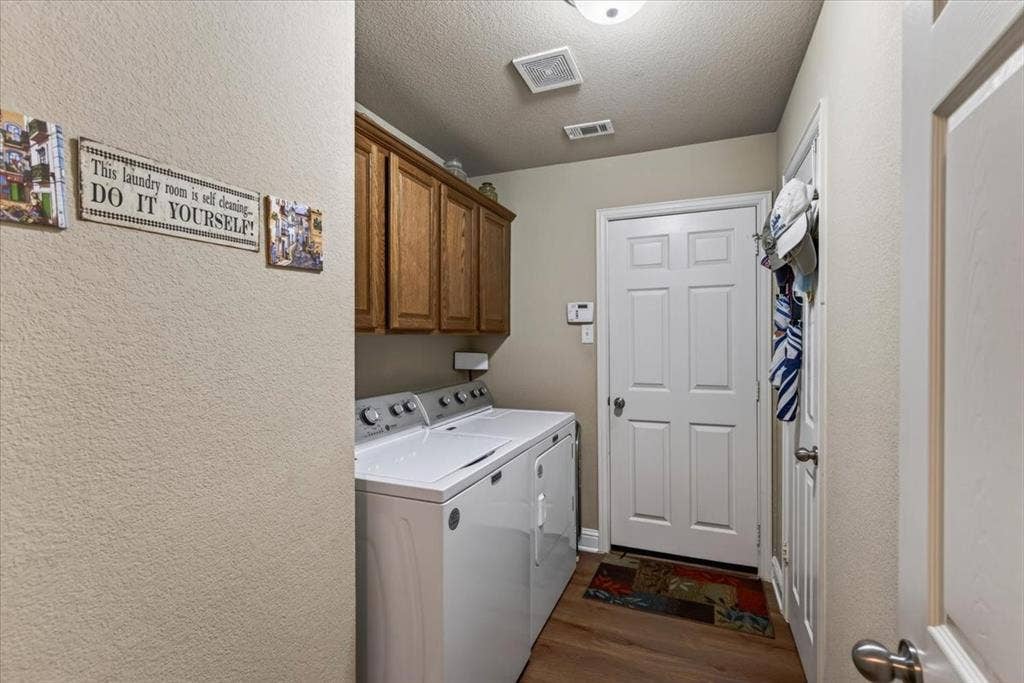 10165 Bantry Lane, Forney, TX 75126 laundry room with upper cabinets