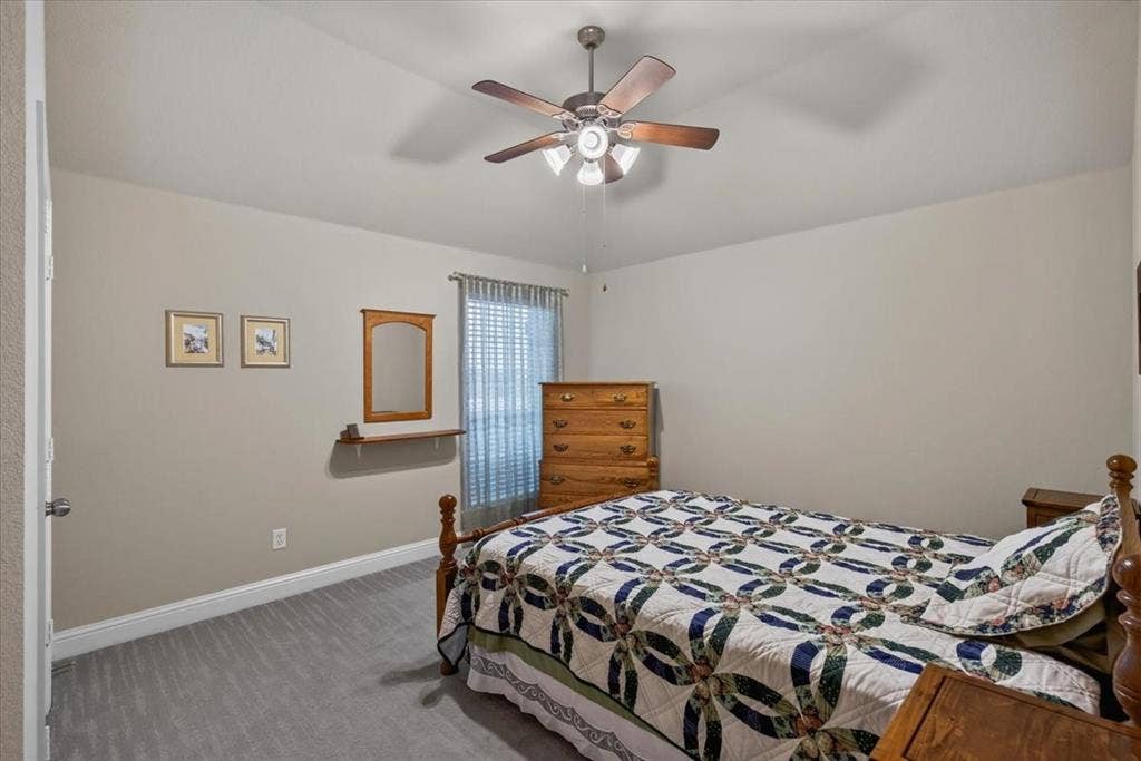 10165 Bantry Lane, Forney, TX 75126 secondary bedroom with ceiling fan