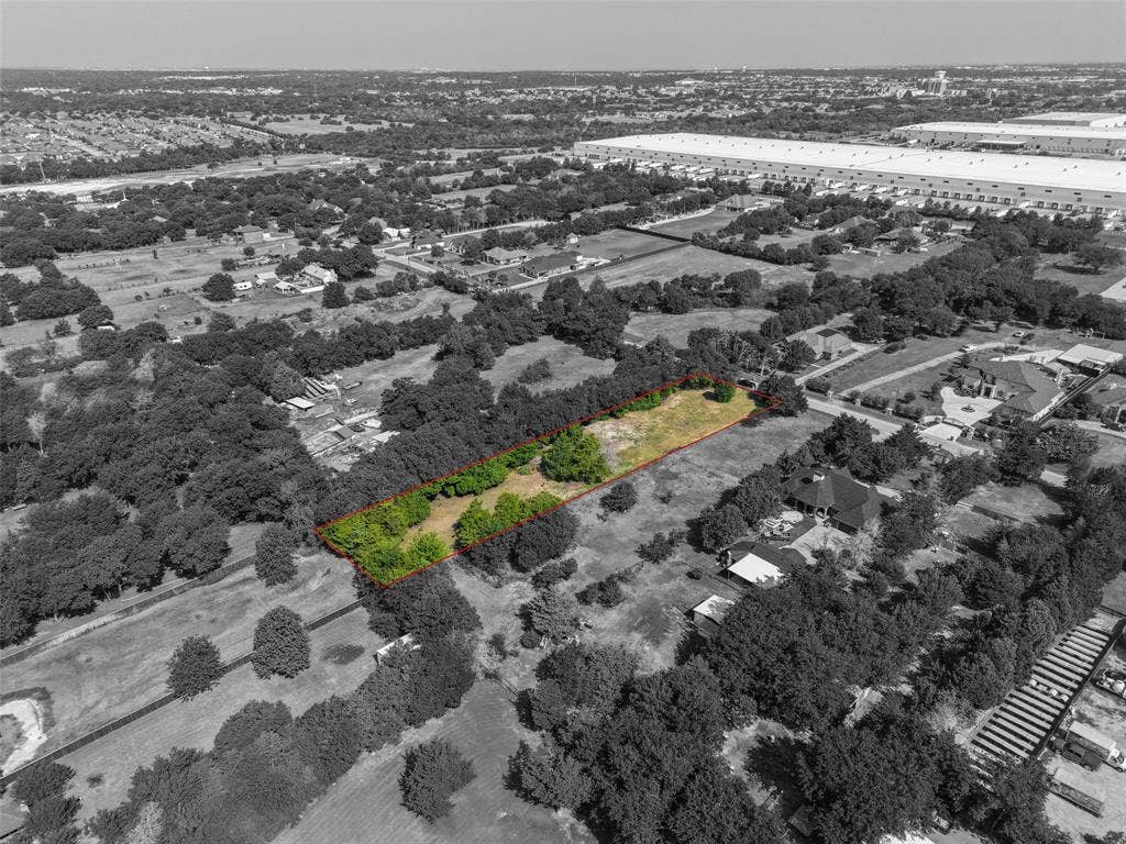 12 Winston Drive, DeSoto, TX 75115 Expansive land parcel outlined in red, featuring a mix of mature trees and open clearings