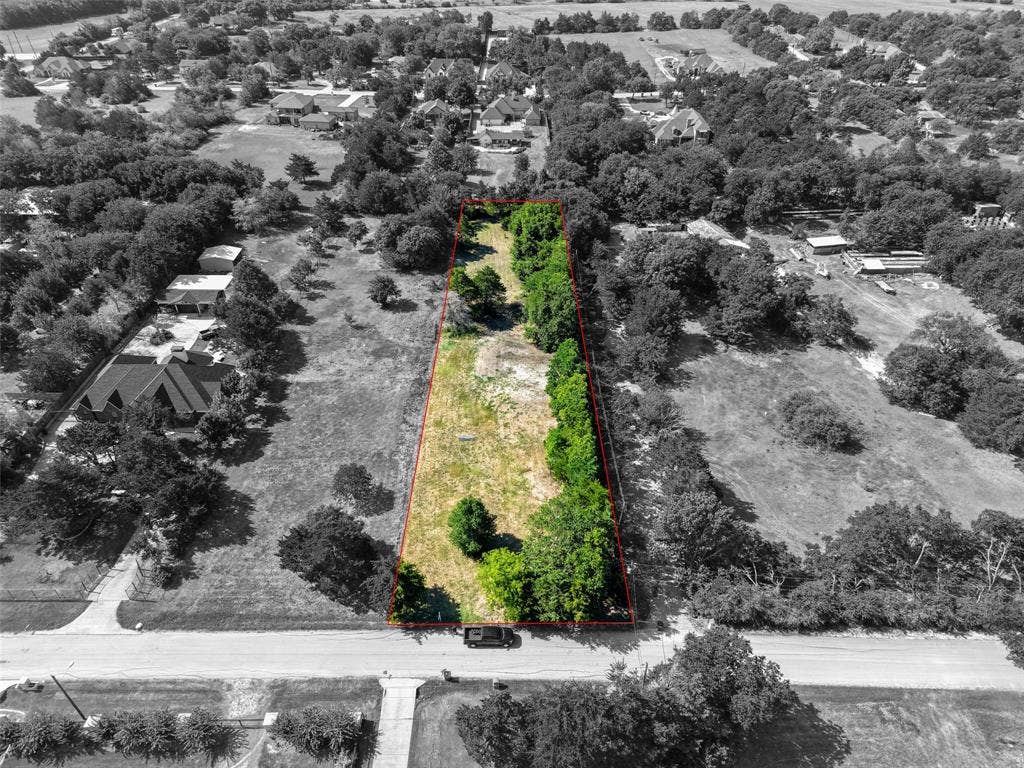 12 Winston Drive, DeSoto, TX 75115 Expansive land parcel featuring a rectangular shape and mature trees