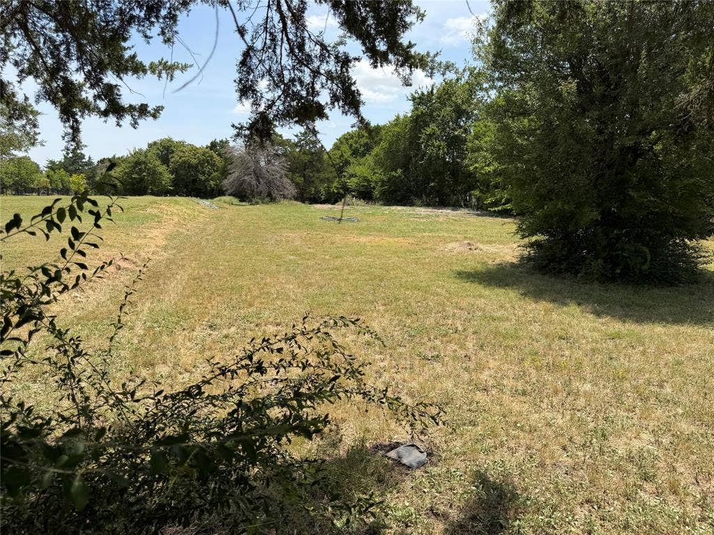 12 Winston Drive, DeSoto, TX 75115 cover and distant mature trees