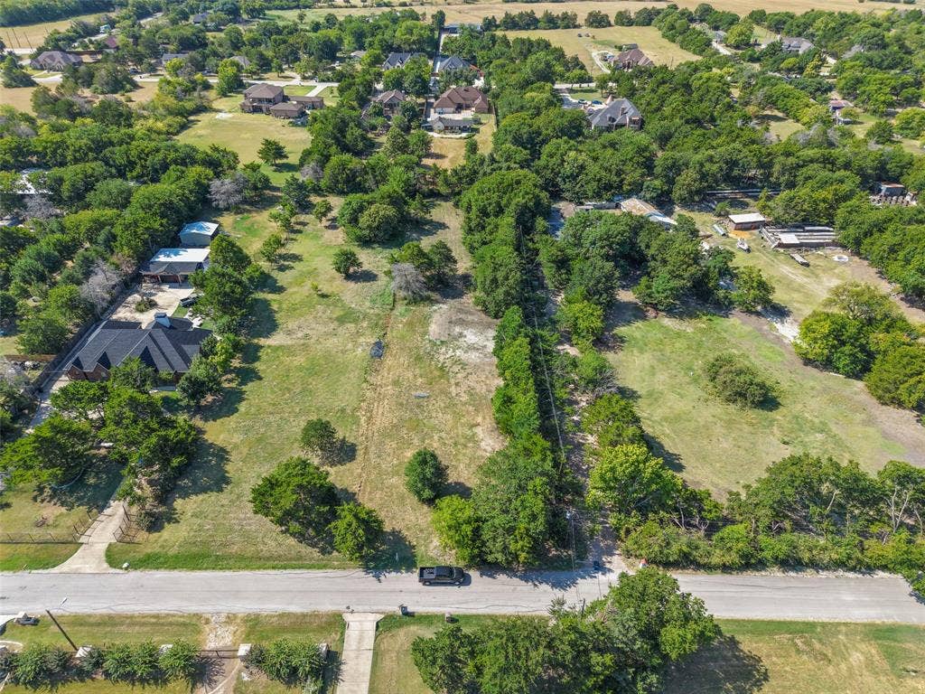 12 Winston Drive, DeSoto, TX 75115 Expansive green lot with established trees and surrounding residential properties