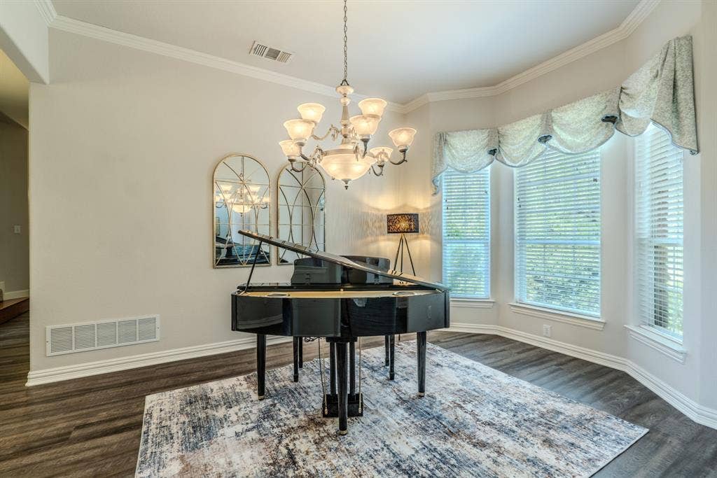 6420 Shady Oaks Lane, Midlothian, TX 76065 Formal dining room with bay windows and decorative lighting-currently being used as an entertainment area with piano.
