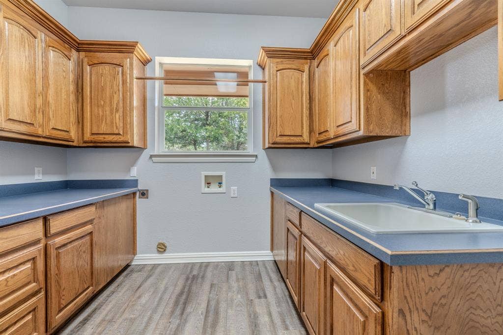 6420 Shady Oaks Lane, Midlothian, TX 76065 Tons of space in this laundry room with room for a refrigerator. Look at all that storage space and sink!