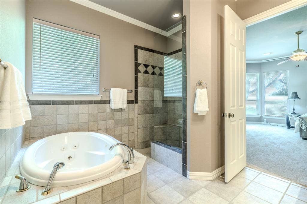 6420 Shady Oaks Lane, Midlothian, TX 76065 Another view of the primary bathroom facing the inviting jetted tub and large shower.