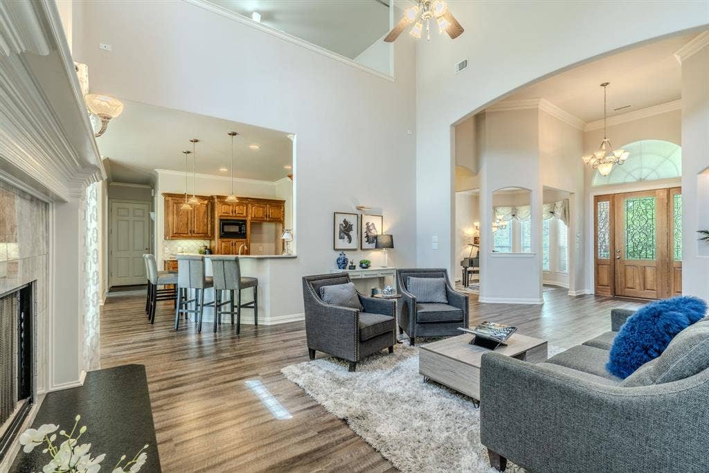 6420 Shady Oaks Lane, Midlothian, TX 76065 Another view of the spacious living area facing the breakfast bar, entryway, and formal dining room.