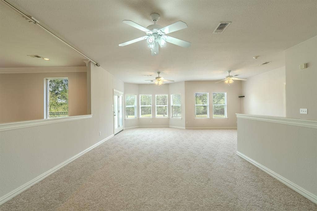 6420 Shady Oaks Lane, Midlothian, TX 76065 View of the loft area next to the game room area. So much room for entertaining here! Look at all those windows!