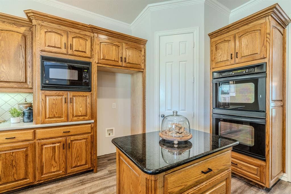 6420 Shady Oaks Lane, Midlothian, TX 76065 Kitchen island facing the double oven and HUGE pantry.