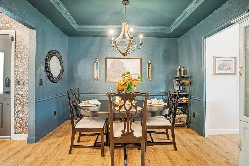 8201 Christie Drive, Frisco, TX 75033 Dining area featuring wood-finish flooring and a coffered ceiling
