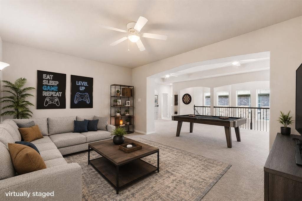 4109 Rainey Street, McKinney, TX 75070 Spacious bonus room featuring a built-in pool table, vaulted ceilings, and an open railing overlooking the lower level