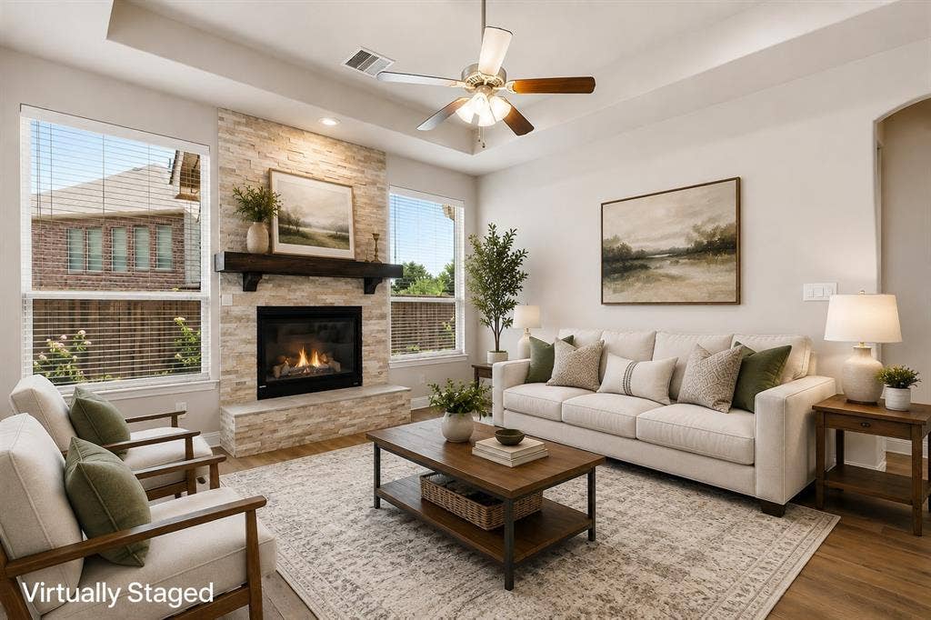 4109 Rainey Street, McKinney, TX 75070 Living area featuring a stone-clad fireplace with a wood mantel, wood-finish flooring, a ceiling fan, and recessed lighting